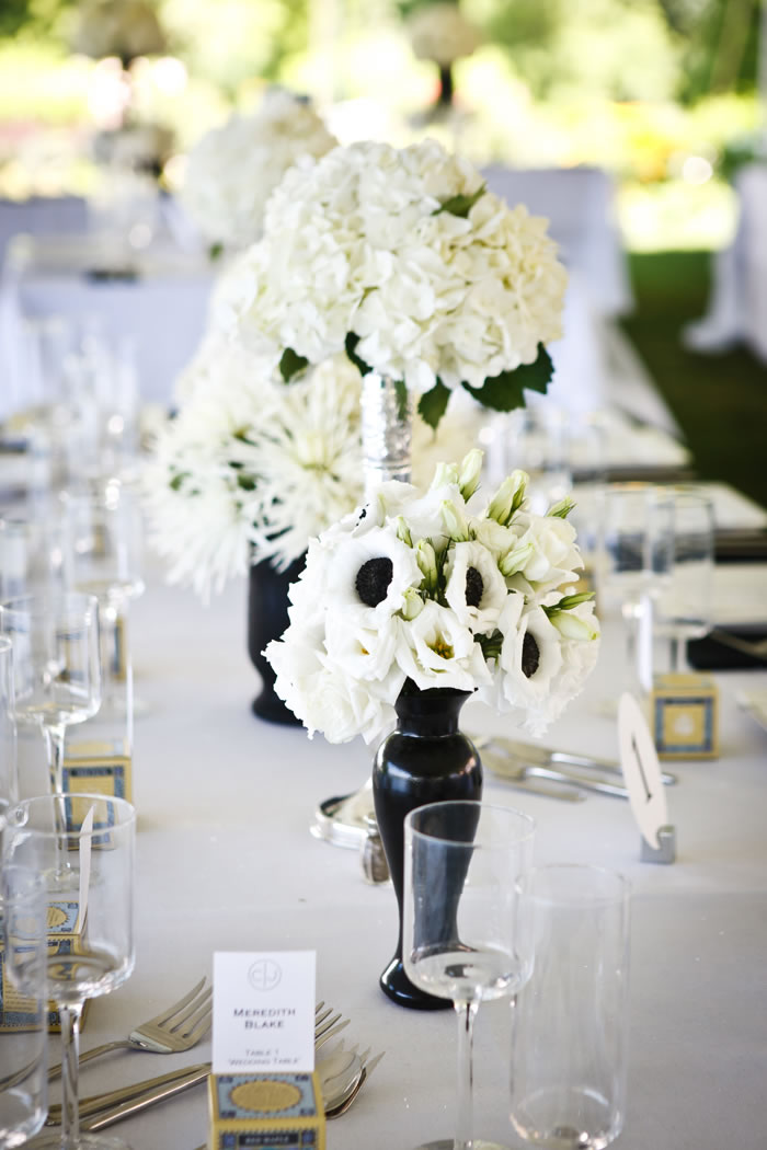 Here is another example of how you can combine sizes of centerpieces at your reception. Photo courtesy of Genevieve Nisly Photography.