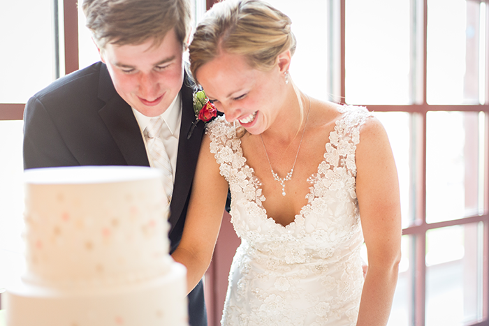 Ashley & Brad - The Club at Key Center Wedding | Orchard Photography | Real Ohio Wedding as seen on Todaysbride.com | Cleveland wedding, wedding photography, cutting the cake