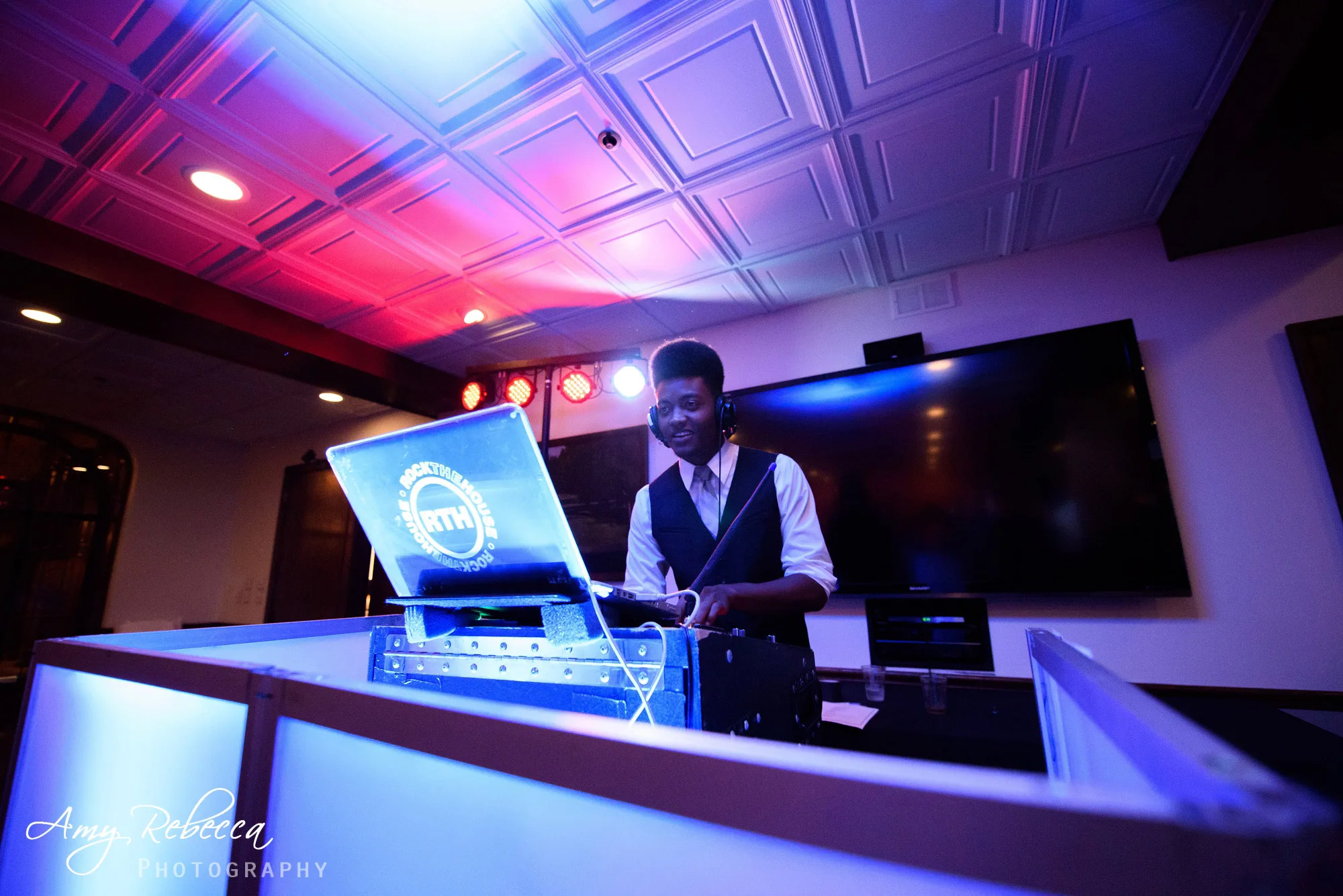 rock the house entertainment wedding dj performing at wedding