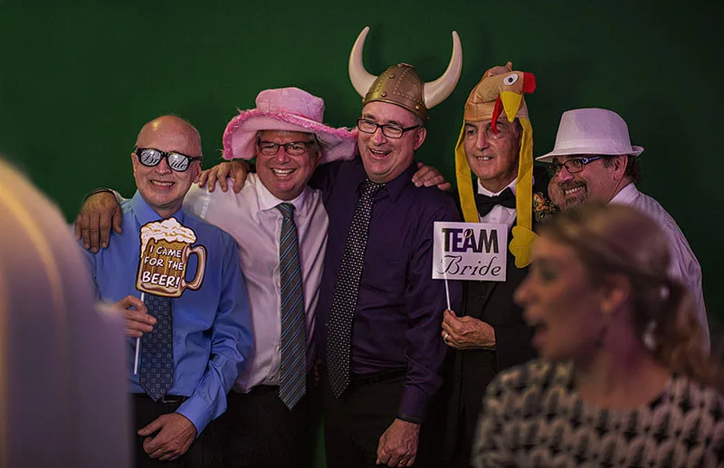 rock the house entertainment wedding photo booth for guests dressed up with props