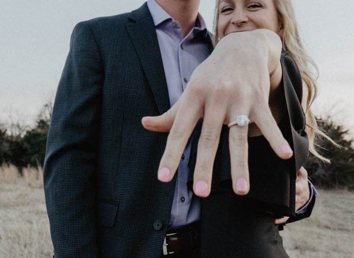 Bride Poses with Engagement Bring and Gold Bracelets