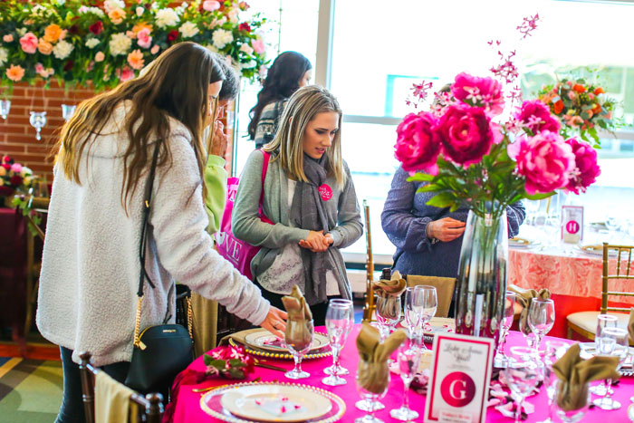 Girls looking at Wedding Table | Bridal Show | As seen on TodaysBride.com