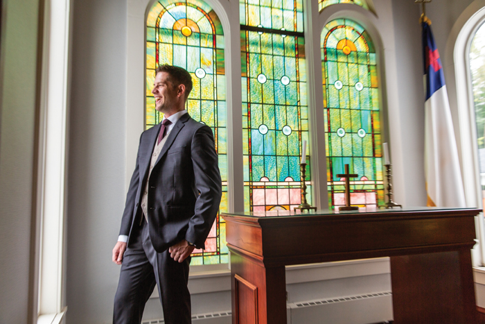 Groom in Church | The Cleveland Photographic Co. | As seen on TodaysBride.com