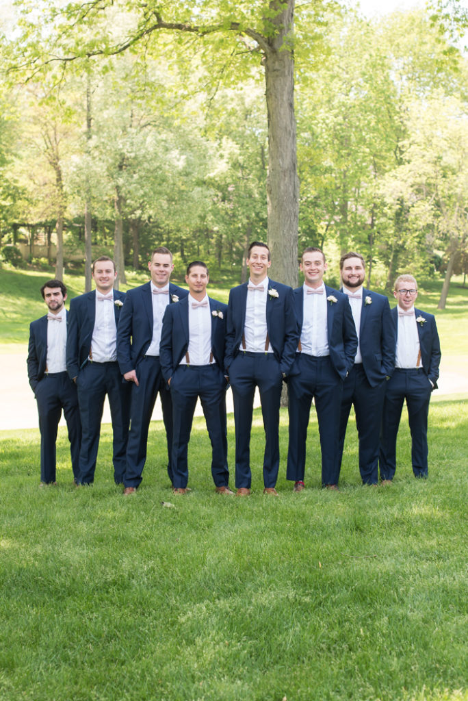 Groom and groomsmen in suits | Sabrina Hall Photography | As seen on TodaysBride.com