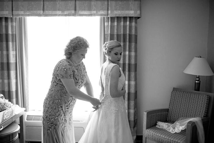 Mom helping Bride get dressed | Cirino Photography | As seen on TodaysBride.com