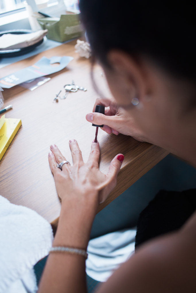 Woman applying nail polish | Orchard Photography | As seen on TodaysBride.com