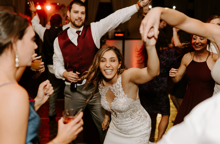 Wedding guests dancing at reception