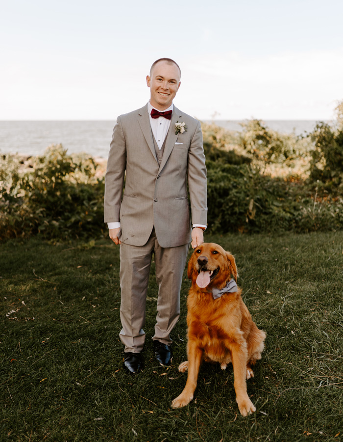 Groom portrait with dog