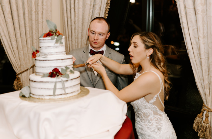 Bride and groom cutting cake