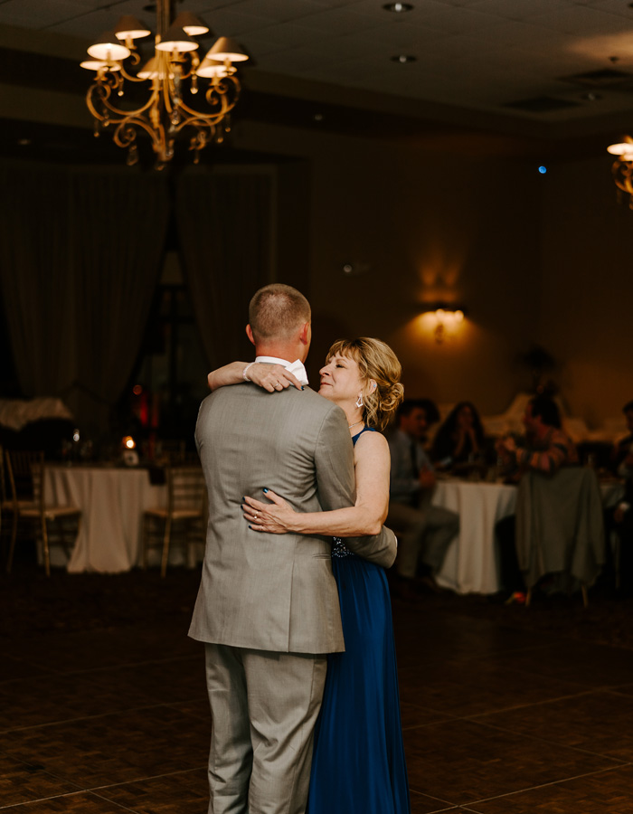 Mother and son dancing at wedding