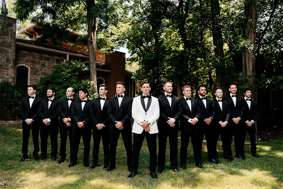 groomsmen in black suits