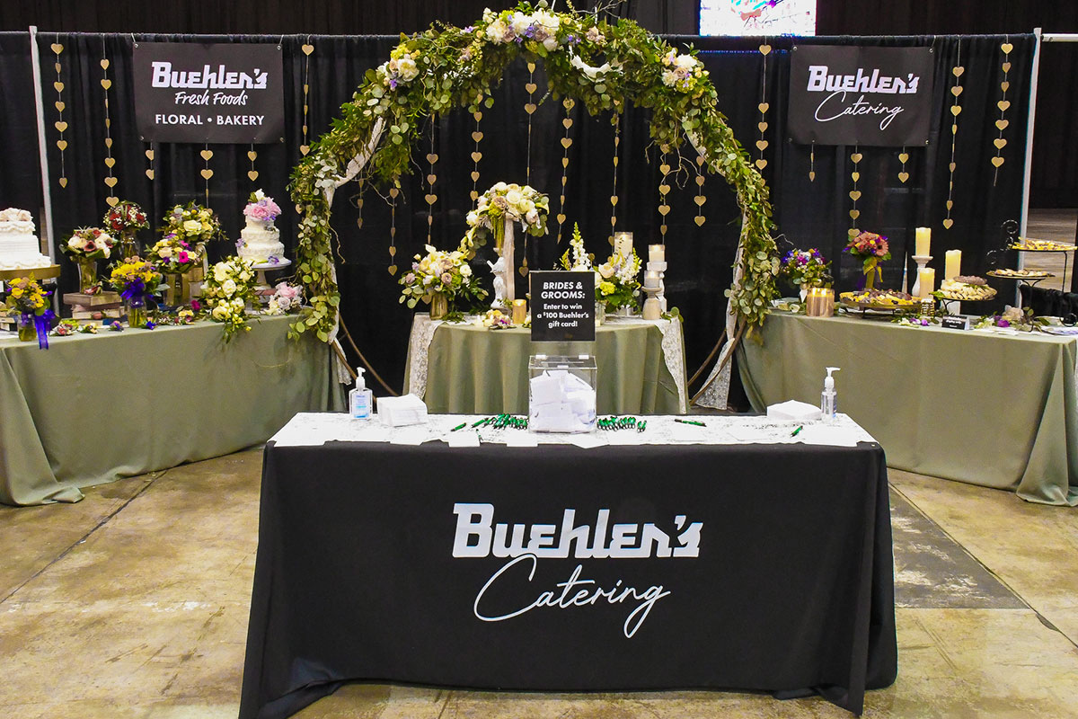 Buehler's catering, flowers, and cake display at the june 2025 bridal show