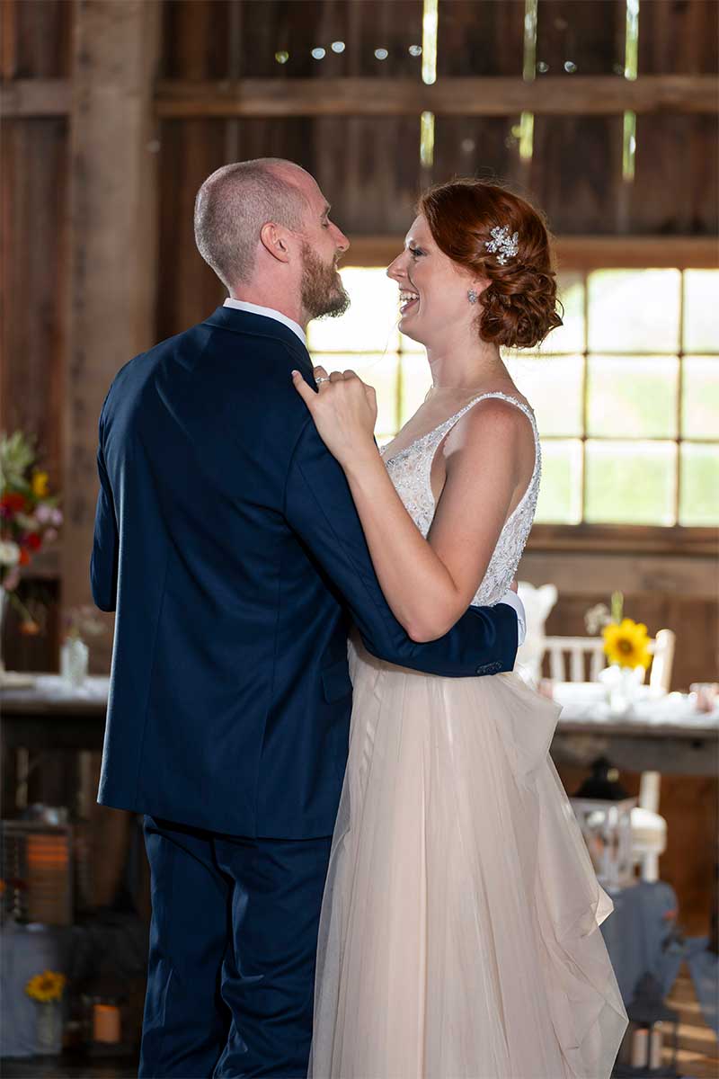 couple's first dance at barn wedding
