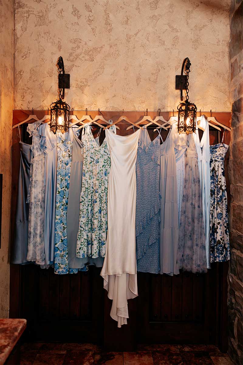 bridesmaids and wedding dress hanging