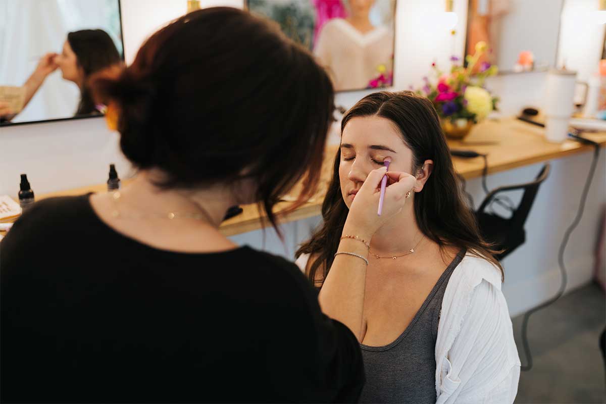 bride gettting makeup done