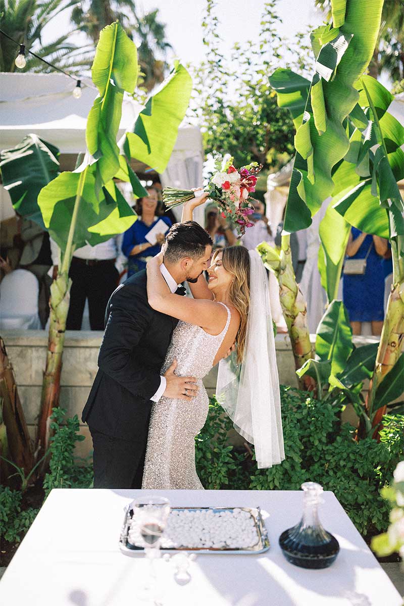 couple kissing at wedding