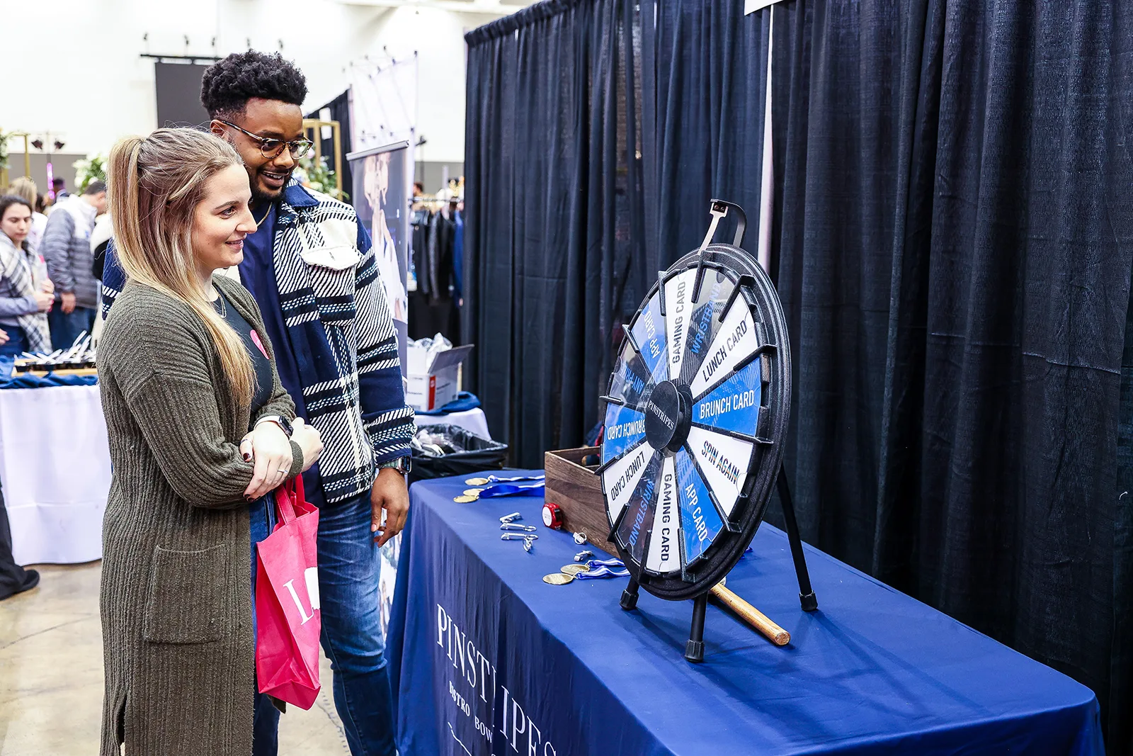 prize wheel at the show - 15 Wedding Expo Booth Ideas That Attract More Couples prize wheel at the show